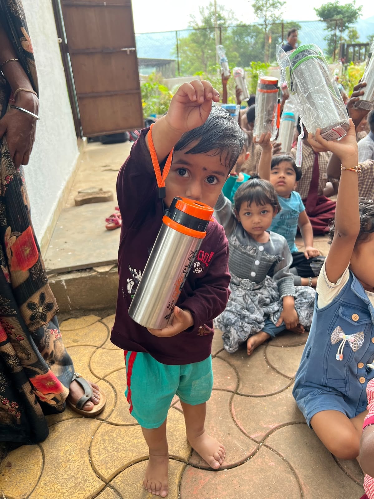 Children holding their new water bottles